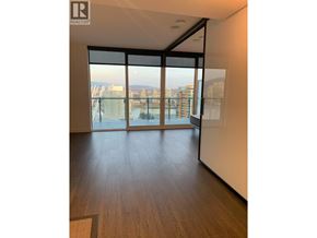 Vancouver apartment for rent - A room with a view of the city through large windows.