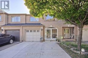 Toronto (West Humber-Clairville) townhouse for rent - A house with a tree in front of it.