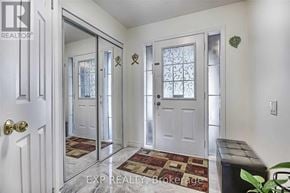 Toronto (West Humber-Clairville) townhouse for rent - A hallway with a bench and two doors with glass panels.