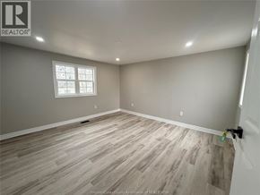 Windsor apartment for rent - A room with wooden flooring and a window.