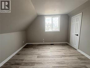 Windsor apartment for rent - A room with a wooden floor and a window.