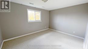 Markham (Royal Orchard) apartment for rent - A room with a window and a carpeted floor.