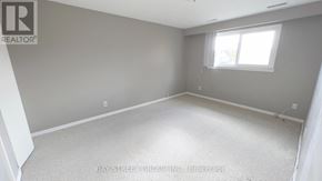 Markham (Royal Orchard) apartment for rent - A room with a carpeted floor and a window with blinds.