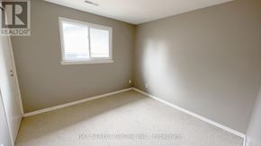 Markham (Royal Orchard) apartment for rent - A room with a window and a carpeted floor.