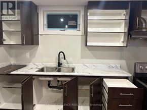 Barrie (Grove East) apartment for rent - A kitchen with a sink and a window.