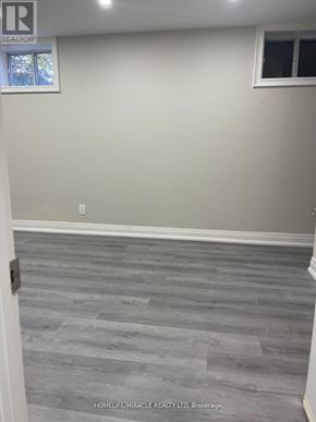 Toronto (Tam O'shanter-Sullivan) apartment for rent - A room with a grey floor and white walls.