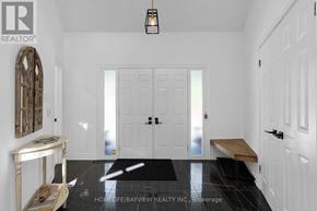 Oro-Medonte (Horseshoe Valley) apartment for rent - A hallway with white doors and a black floor mat.