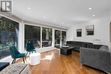 Oro-Medonte (Horseshoe Valley) apartment for rent - A modern living room with a grey couch and a green chair.