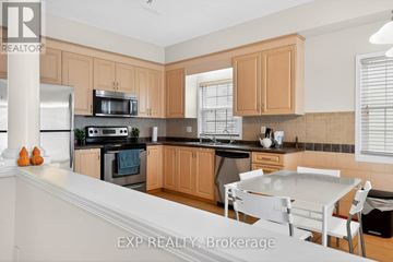 Waterloo apartment for rent - A kitchen with wooden cabinets and a white countertop.