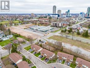 Niagara Falls (Arad/Fallsview) apartment for rent - An aerial view of a city with buildings, roads, and cars.