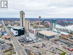 Niagara Falls (Arad/Fallsview) apartment for rent - A cityscape with a tall tower and a bridge in the background.