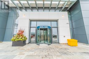 Vaughan (Vaughan Corporate Centre) condo for rent - The entrance to a building with a glass door and a sign that reads "225-195".