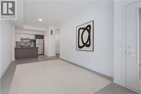 Burlington townhouse for rent - A hallway with a carpeted floor and a framed picture on the wall.