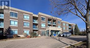 Brampton (Sandringham-Wellington) condo for rent - A building with the sign RE/MAX WEST REALTY INC. Brokerage in front of it.