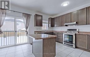Shelburne apartment for rent - A kitchen with a stove top oven and a microwave.