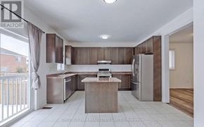 Shelburne apartment for rent - A kitchen with a refrigerator, sink, and cabinets.