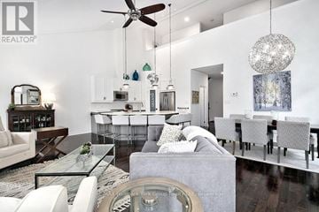 Blue Mountains townhouse for rent - A modern living room with a glass table and white furniture.