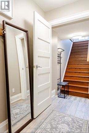 Toronto (Birchcliffe-Cliffside) apartment for rent - A hallway with a white door and a staircase.