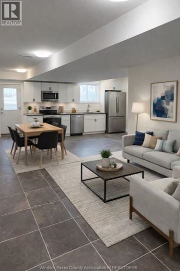 Windsor duplex for rent - A modern kitchen with a dining table and a couch.