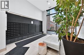 Kitchener condo for rent - A modern living room with a black and white color scheme.