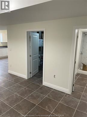 Windsor apartment for rent - A room with a tiled floor and a doorway leading to another room.