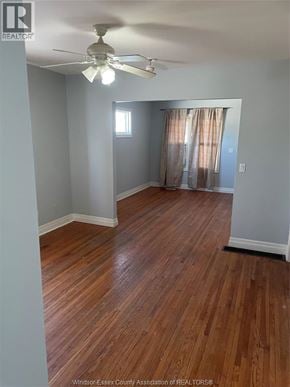 Windsor apartment for rent - A room with wooden floors and a ceiling fan.