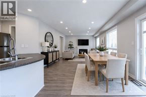 Brantford apartment for rent - A modern kitchen with a dining table and chairs.