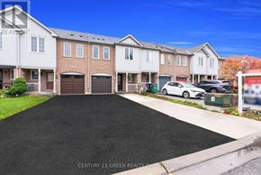 Mississauga (Churchill Meadows) townhouse for rent - A row of houses with a car parked in front of the first house.