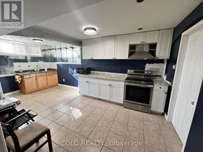 Hamilton (Jerome) apartment for rent - A kitchen with white cabinets and a blue backsplash is for sale.