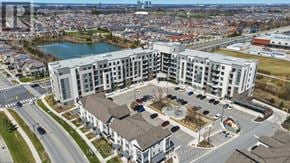 Milton (Fo Ford) condo for rent - A large apartment complex with a fountain in the courtyard.
