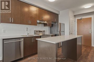 Milton (Fo Ford) condo for rent - A kitchen with wooden cabinets and stainless steel appliances.