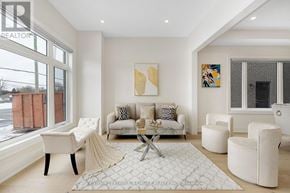 Brampton (Bram West) apartment for rent - A living room with a white couch and a coffee table.