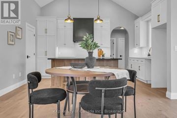 Norwich (Otterville) apartment for rent - A kitchen with a table and chairs in the foreground.