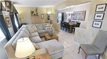 Ottawa townhouse for rent - A living room with a grey couch and a wooden coffee table.