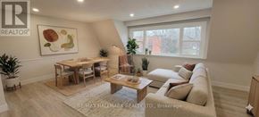 Richmond Hill (Mill Pond) apartment for rent - A living room with a couch, a table, and a painting on the wall.