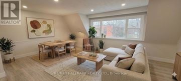 Richmond Hill (Mill Pond) apartment for rent - A living room with a couch, a table, and a painting on the wall.