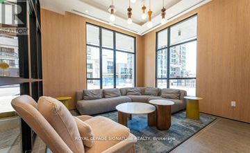 Milton (Cb Cobban) condo for rent - A living room with a couch, chairs and a coffee table.