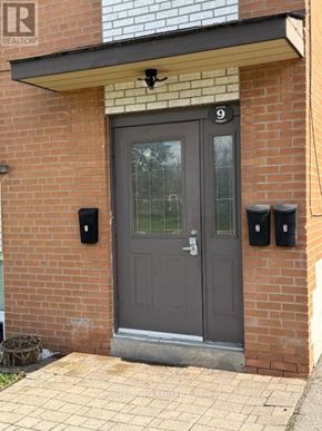 Mississauga (Streetsville) multi-family for rent - A grey door with a number 9 above it.