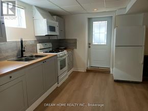 Richmond Hill (Westbrook) apartment for rent - A kitchen with a white refrigerator and a white door.