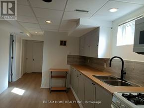 Richmond Hill (Westbrook) apartment for rent - A kitchen with a stove, sink, and cabinets.