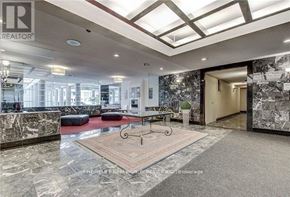 Toronto (Newtonbrook East) condo for rent - A spacious lobby with a marble floor and a large area rug.
