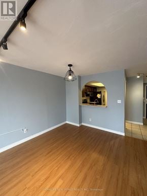 Toronto (Newtonbrook East) condo for rent - A room with wooden flooring and a mirror on the wall.
