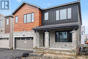 Ottawa apartment for rent - A modern house with a garage is under construction.