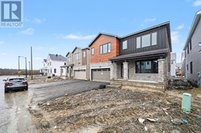 Ottawa apartment for rent - A house under construction with a car parked in front.