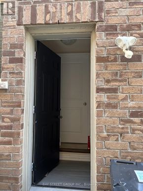 Brampton (Bram East) apartment for rent - A doorway with a black door and a sign above it that says "REALTOR".