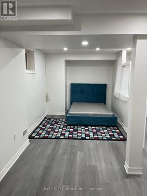 Brampton (Bram East) apartment for rent - A bedroom with a bed in the middle of the room.