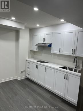Brampton (Bram East) apartment for rent - A kitchen with white cabinets and a sink.