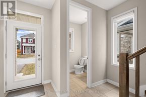Ottawa apartment for rent - A white door with a glass window showing a red house.
