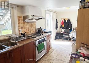 Markham (Thornlea) apartment for rent - A kitchen with a stove top oven and a sink.