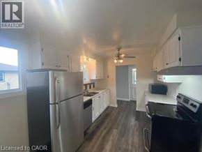 Hamilton apartment for rent - A kitchen with a refrigerator, stove, and oven.